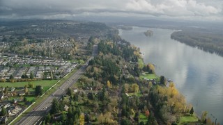 AX153_143E - 5.5K aerial stock footage flying over suburban homes between Highway 14 and Columbia River, Vancouver, Washington