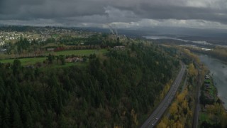 AX153_147 - 5.5K aerial stock footage flying by mansions to approach a hilltop suburban neighborhood in Camas, Washington