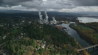 AX153_149E - 5.5K aerial stock footage flying over Highway 14 to approach paper mill in Camas, Washington