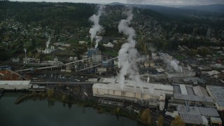 AX153_153 - 5.5K aerial stock footage orbiting Georgia Pacific Paper Mill in Camas, Washington