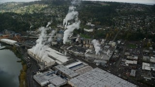AX153_153E - 5.5K aerial stock footage orbiting Georgia Pacific Paper Mill in Camas, Washington