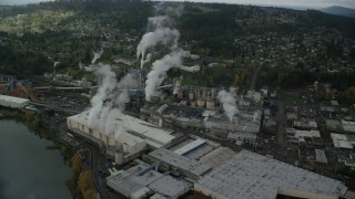 AX153_154 - 5.5K stock footage aerial video orbiting the Georgia Pacific Paper Mill, Camas, Washington