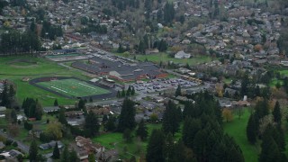 AX153_164E - 5.5K aerial stock footage of elementary and high schools in Washougal, Washington