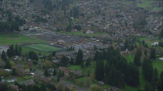 AX153_165 - 5.5K aerial stock footage of Washougal High School and football field in Washougal, Washington