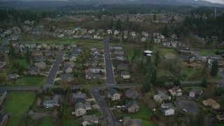 AX153_175 - 5.5K aerial stock footage flying over suburban tract homes in Washougal, Washington