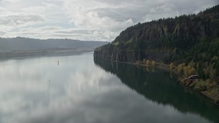 AX154_008 - 5.5K aerial stock footage approaching an isolated home and railroad tunnel in Columbia River Gorge, Washington