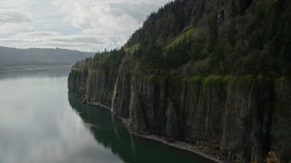 AX154_009E - 5.5K aerial stock footage approaching a railroad tunnel and Cape Horn Falls in Columbia River Gorge, Washington