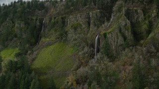 AX154_011 - 5.5K aerial stock footage tracking Cape Horn Falls through steep cliffs in Columbia River Gorge, Washington