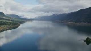 AX154_015E - 5.5K aerial stock footage flying over the Columbia River through Columbia River Gorge, Washington