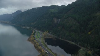 AX154_019 - 5.5K aerial stock footage approaching Multnomah Falls on a Columbia River Gorge cliff face in Multnomah County, Oregon