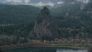 AX154_026E - 5.5K aerial stock footage flying by Beacon Rock in Columbia River Gorge, Skamania County, Washington