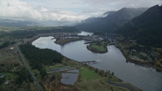 AX154_028 - 5.5K aerial stock footage approaching Bonneville Dam in the Columbia River Gorge