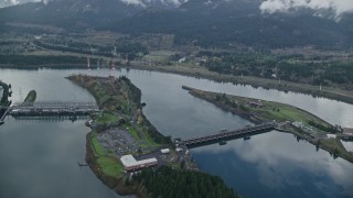 AX154_034E - 5.5K aerial stock footage orbiting the Bonneville Dam in the Columbia River Gorge