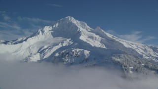 AX154_079 - 5.5K aerial stock footage of Mount Hood covered in snow, Mount Hood, Cascade Range, Oregon