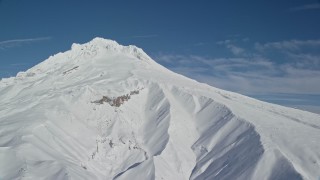 AX154_084E - 5.5K aerial stock footage of Mount Hood covered in snow, Mount Hood, Cascade Range, Oregon