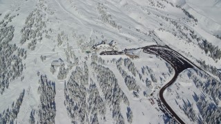 AX154_095 - 5.5K aerial stock footage of Timberline Lodge on the snowy slopes of Mount Hood, Cascade Range, Oregon