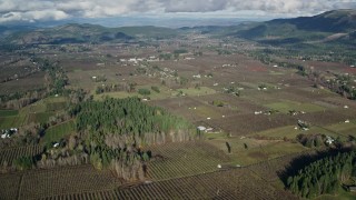 AX154_138 - 5.5K aerial stock footage approaching farms and fields in Parkdale, Oregon