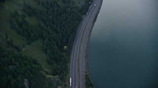 AX154_159E - 5.5K aerial stock footage of a bird's eye view of light traffic on Interstate 84 in Columbia River Gorge, Hood River County, Oregon