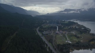 AX154_166 - 5.5K aerial stock footage flying over I-84 and forest by the small town of Cascade Locks, Oregon in Columbia River Gorge