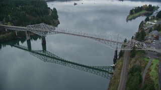AX154_174 - 5.5K aerial stock footage of a reverse view of the Bridge of the Gods in Cascade Locks, Columbia River Gorge, Oregon