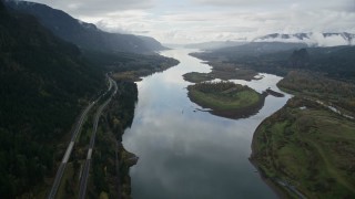 AX154_179E - 5.5K aerial stock footage following Columbia River and I-84 highway, flyby islands in Columbia River Gorge
