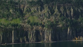 AX154_193E - 5.5K aerial stock footage of waterfalls and steep green cliffs on the Washington side of Columbia River Gorge