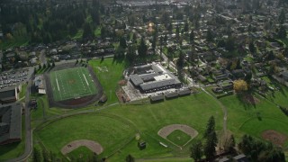 AX154_207E - 5.5K aerial stock footage orbiting Gause Elementary, Washougal High School and sports fields in Washougal, Washington