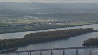 AX154_217 - 5.5K aerial stock footage of Portland International Airport seen from across the Columbia River