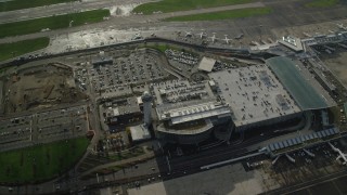 AX154_222 - 5.5K aerial stock footage of a bird's eye view of the control tower and parking structure at the Portland International Airport, Oregon
