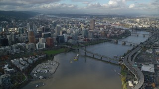 AX154_235 - 5.5K aerial stock footage orbiting skyscrapers in Downtown Portland, Oregon, seen from across the Willamette River