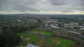 AX155_009 - 5.5K aerial stock footage of Nike office buildings and new building construction, Beaverton, Oregon