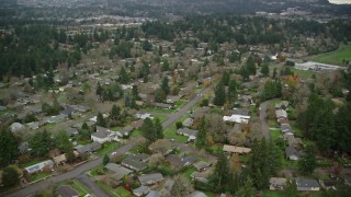 AX155_012 - 5.5K aerial stock footage of homes in a suburban neighborhood in autumn, Beaverton, Oregon