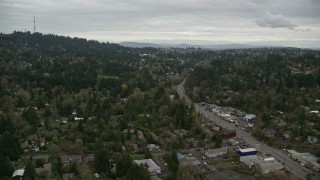 AX155_016E - 5.5K aerial stock footage flying over suburban neighborhood beside SW Beaverton Hillsdale Highway in Southwest Portland, Oregon