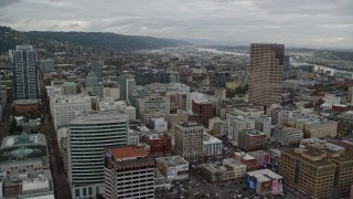 AX155_030E - 5.5K aerial stock footage flying by downtown buildings and US Bancorp Tower in Downtown Portland, Oregon