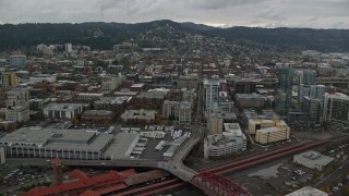 AX155_032E - 5.5K aerial stock footage flying by Union Station, apartment buildings, The Fields Park, and freeway interchange in Downtown Portland, Oregon