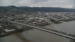 AX155_034 - 5.5K aerial stock footage orbiting the Fremont Bridge in Downtown Portland, Oregon