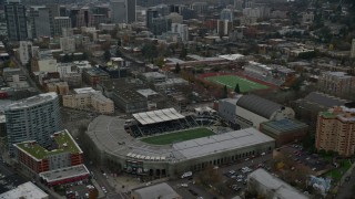 AX155_057 - 5.5K stock footage aerial video tilting to and flyby Providence Park in Goose Hollow, Portland, Oregon