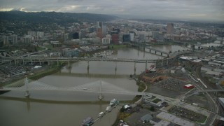 AX155_063 - 5.5K aerial stock footage flying over bridges to approach Downtown Portland, Oregon