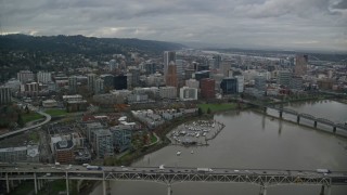 AX155_063E - 5.5K aerial stock footage flying over bridges and skyscrapers in Downtown Portland, Oregon