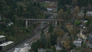 AX155_066 - 5.5K aerial stock footage of Vista Bridge over SW Jefferson Street in the Goose Hollow neighborhood of Portland, Oregon