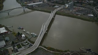AX155_077E - 5.5K aerial stock footage of Tilikum Crossing bridge and the Willamette River in South Portland, Oregon
