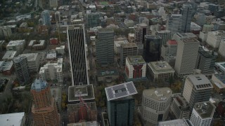 AX155_106 - 5.5K aerial stock footage orbiting Wells Fargo Center, Portland City Hall, and parks in Downtown Portland, Oregon