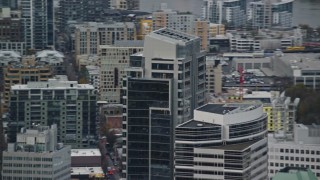 AX155_117 - 5.5K aerial stock footage tracking the tops of Park Avenue West Tower and Fox Tower in Downtown Portland, Oregon