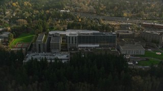 AX155_121E - 5.5K aerial stock footage flying by the Providence St Vincent Medical Center in Southwest Portland, Oregon
