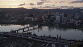 AX155_189 - 5.5K aerial stock footage of Hawthorne Bridge and Downtown Portland at twilight, Oregon