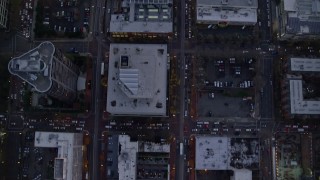 AX155_222E - 5.5K aerial stock footage of a bird's eye view of NW and 5th and 6th Avenue at twilight, reveal US Bancorp Tower, Downtown Portland, Oregon