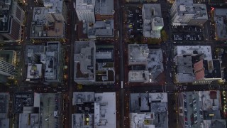 AX155_232E - 5.5K aerial stock footage of a bird's eye view of buildings between SW 6th Avenue SW 5th Avenue at twilight near Pioneer Courthouse, Downtown Portland, Oregon