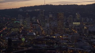 AX155_258 - 5.5K aerial stock footage of US Bancorp Tower and downtown skyscrapers at twilight, Downtown Portland, Oregon