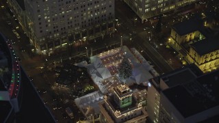 AX155_284 - 5.5K stock footage aerial video of a bird's eye orbit Pioneer Courthouse Square, decorated for Christmas, at night in Downtown Portland, Oregon