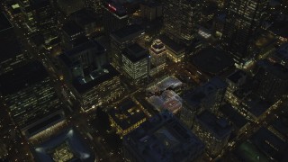 AX155_287 - 5.5K stock footage aerial video of a bird's eye orbit Pioneer Courthouse Square, decorated for Christmas, and Pioneer Courthouse at night in Downtown Portland, Oregon